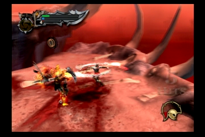 God of War (2005, PS2) — qizil qoyalar ustida zanjirli tig‘lar bilan jang